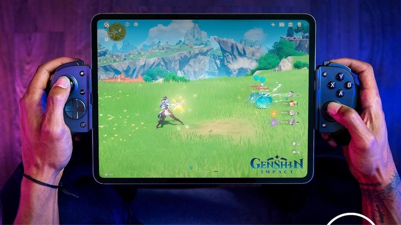 Person playing on iPad with Razer Kishi V3 Pro XL