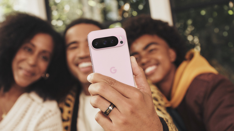 Group taking selfie with Google Pixel phone