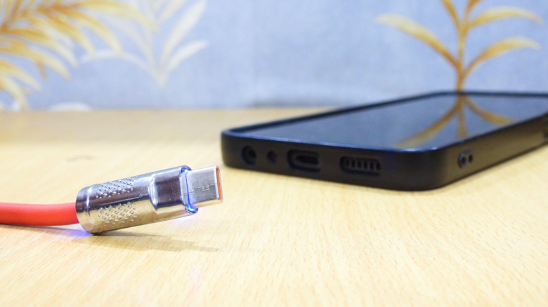 The Realme P4 Power submerged in water.