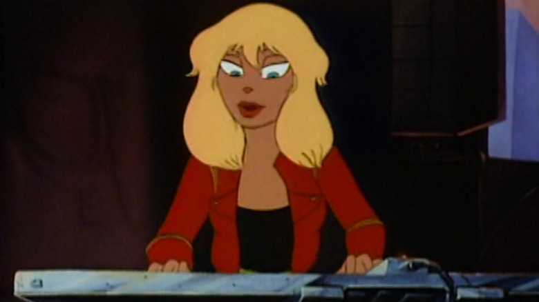 Angel, a blonde woman, playing a keyboard
