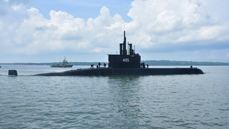 Large manned Indonesian submarine partially submerged.