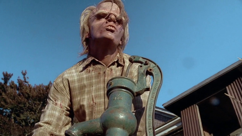 One of the Peacock brothers pumping water at the farm in The X-Files episode Home