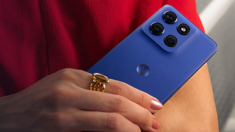 Person holding a Motorola G Stylus smartphone in blue