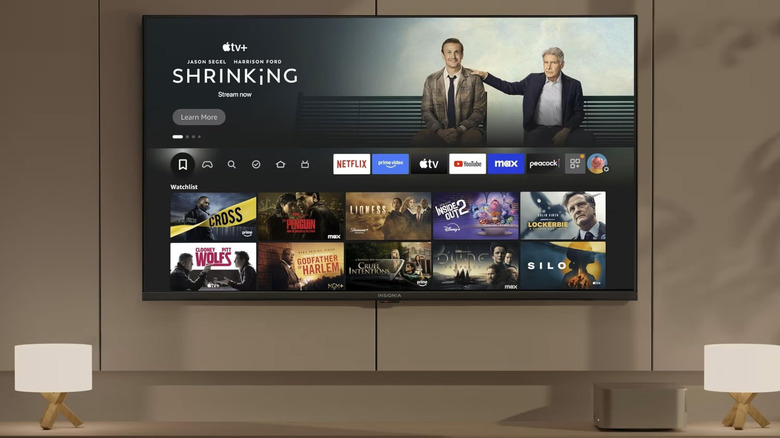 The Insignia F50 4K TV mounted to a wall in a room
