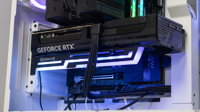 Redragon GPU sag bracket installed below Nvidia card with RGB enabled.