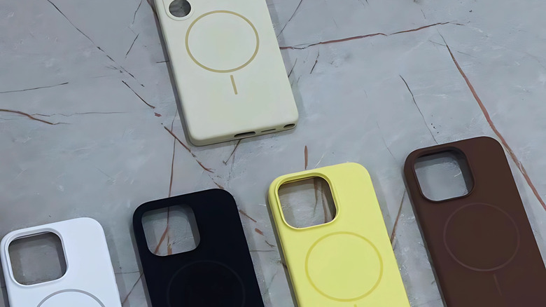 a line of magsafe compatible cases in multi colors laid flat on a surface