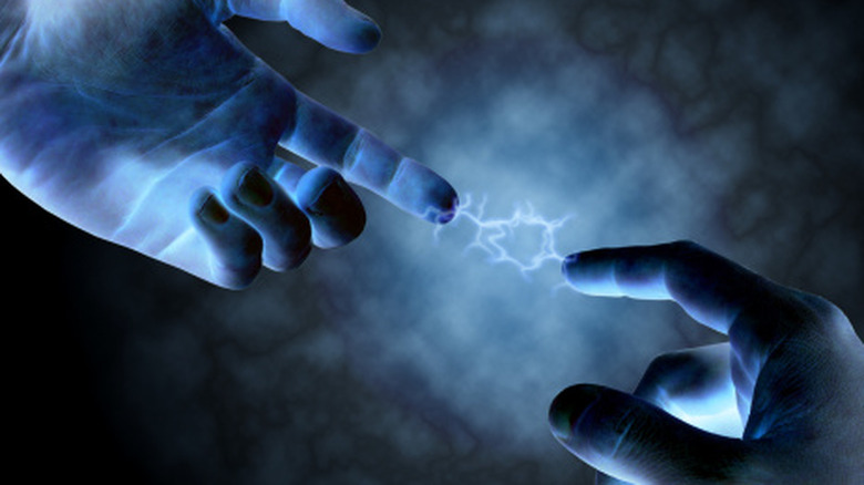 A concept image of static shock between two people.