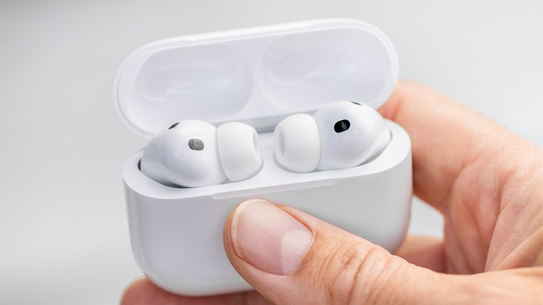 AirPods Pro 3 inside the charging case, held in hand.