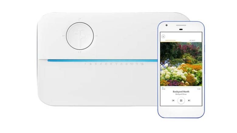 A Costco promotional image for the Rachio 3 Smart Sprinkler Controller, the image shows the main console alongside a smartphone displaying the app