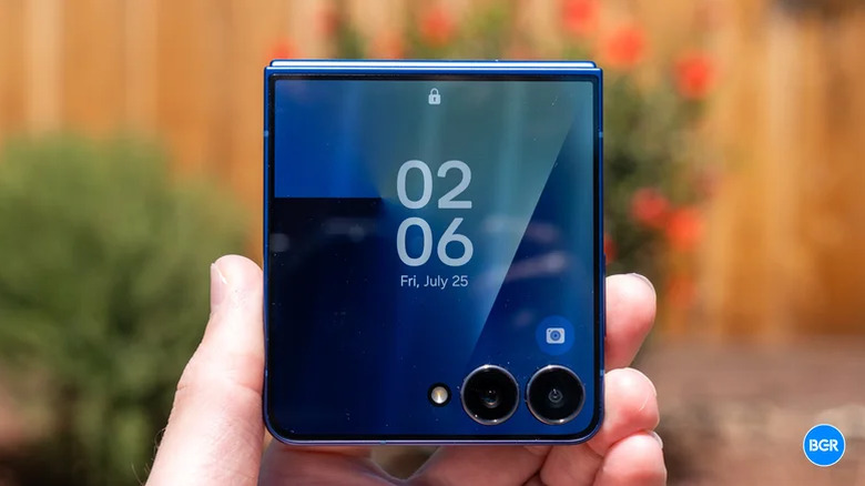 An closeup of a Galaxy Z Flip 7 being held in an individual's left hand