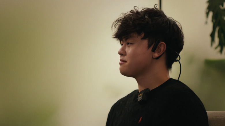 Person wearing AlterEgo's AI device