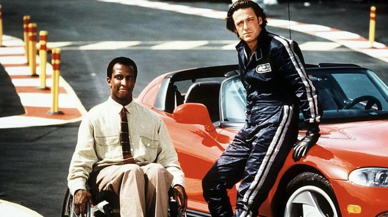 Wilkes and Astor posing next to the Dodge Viper