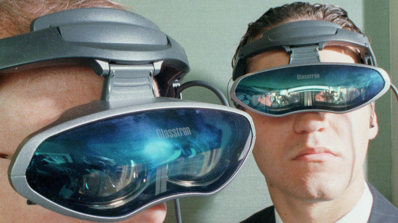 Sony executitves wearing the Sony Glasstron PLM-A35 Personal Viewer in 1998