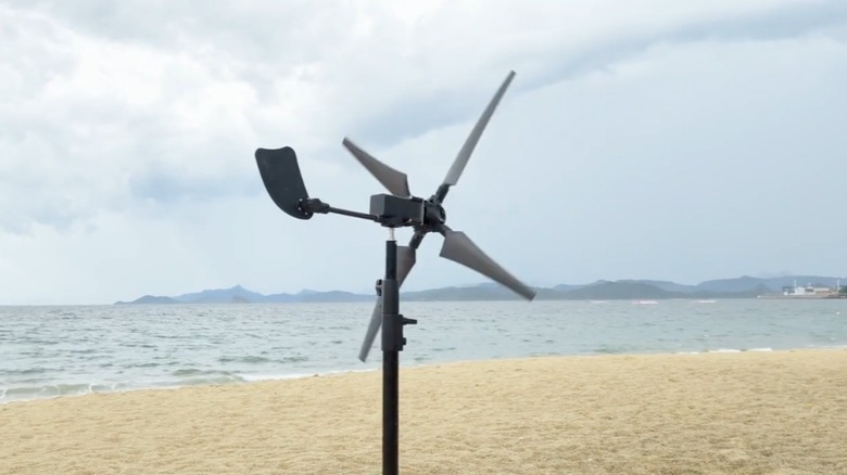 A mini wind turbine set up at the beach