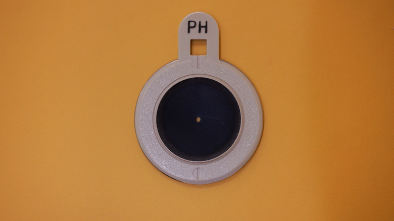 A pinhole tool used during optometry exams.