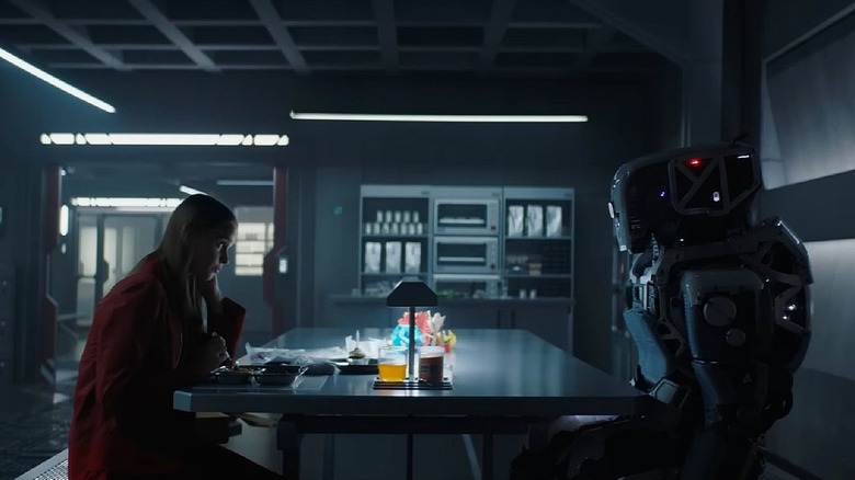 Daughter sitting across from the robot Mother in the movie 