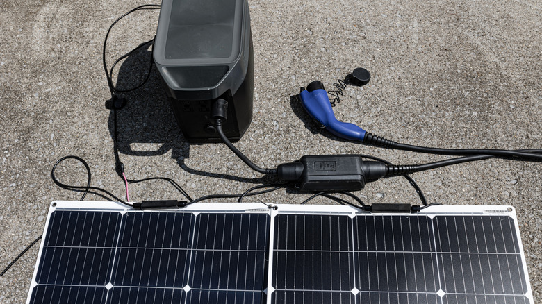 A plug-in solar panel connected to an EV charger