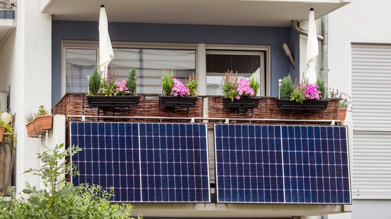 Solar panels attached to a balcony railing
