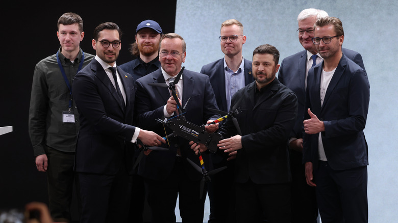 Ukrainian President Zelensky and German Defense Minister Boris Pistorius holding a Linza drone while visiting Quantum Frontline Industries' facility near Munich, Germany.