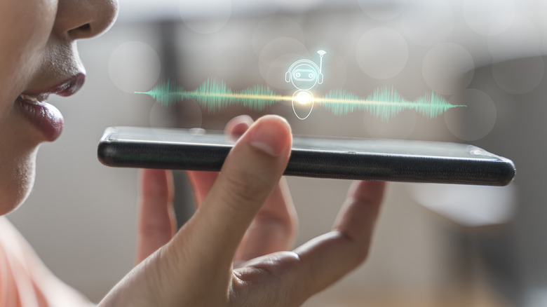 A concept illustration of a person talking to a virtual assistant, a process that can be used to make calls on modern smartphone.