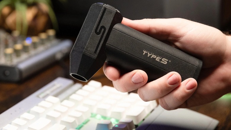 Type S 4 in 1 electric air duster from Costco cleaning a keyboard.