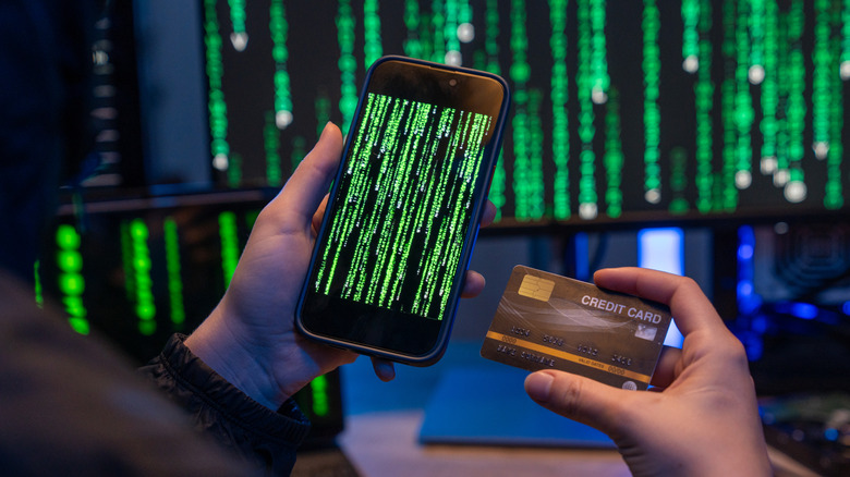 Wanted hackers coding virus ransomware using laptops and computers. Cyber attack, system breaking and malware concept.