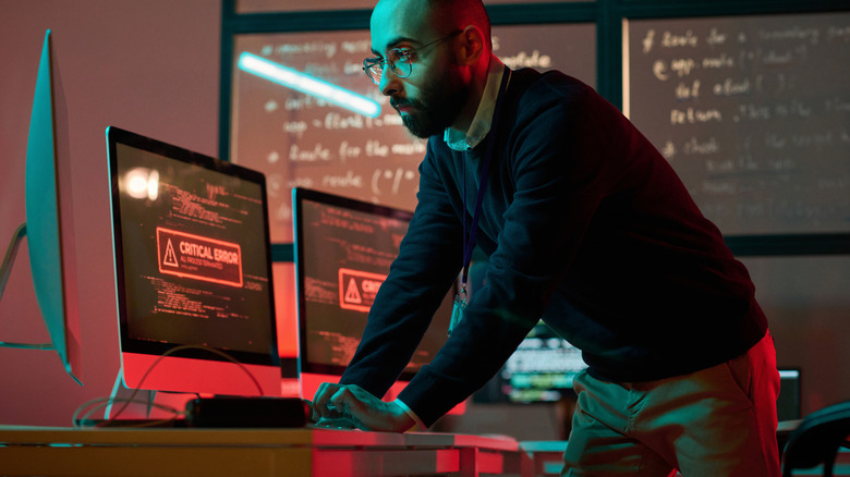 An image of an internet security professional monitoring a system showing a critical error