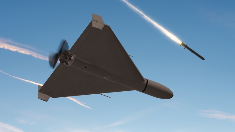 A war drone flying with missiles