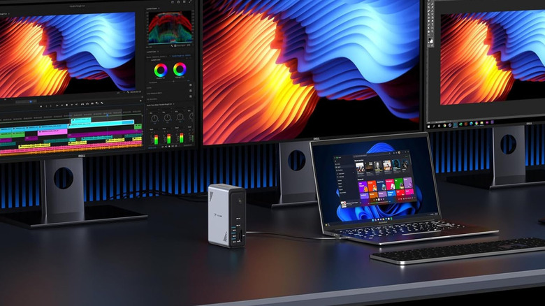 TobenONE USB-C hub in use connected to a laptop and three monitors