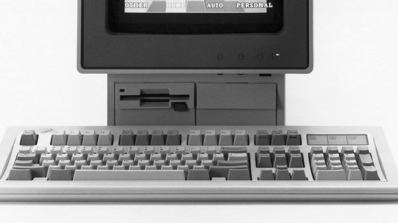 An IBM Model M keyboard under a 1987 terminal.