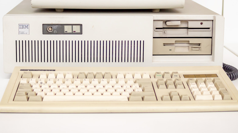 An IBM Model M keyboard under an IBM PC.