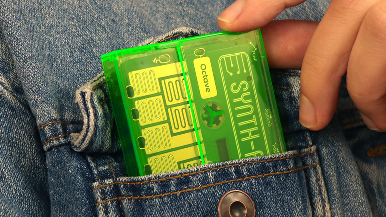 Circuit board in green translucent case in jacket pocket
