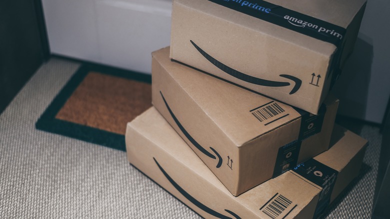 Amazon boxes outside of a front door