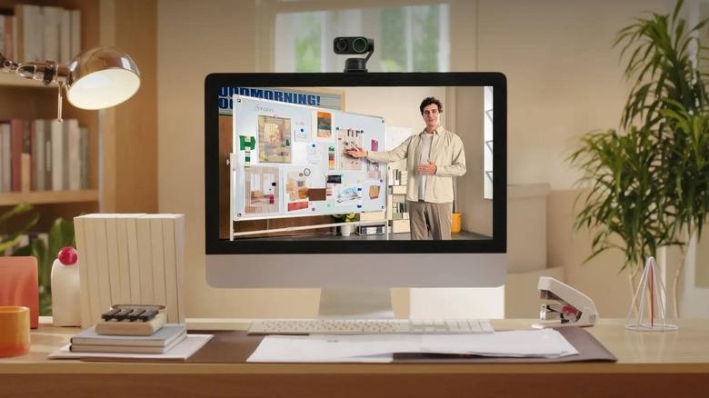 The Insta360 Link 2 Pro mounted on a monitor in an office setup