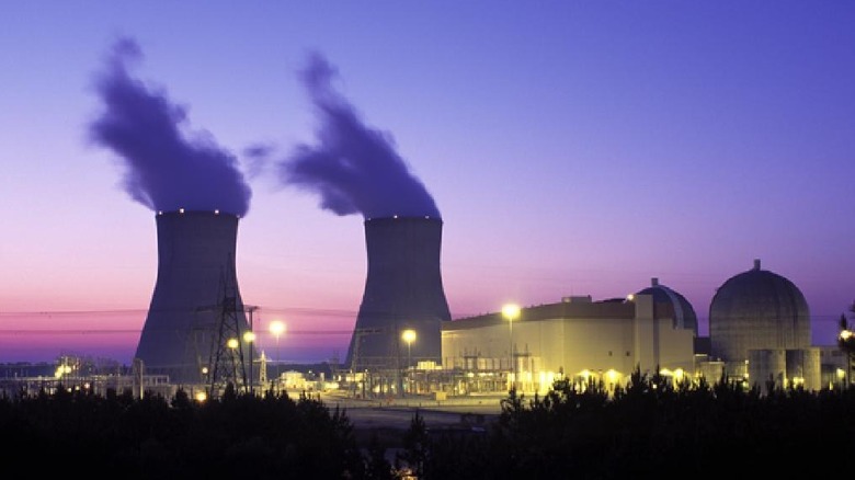 The Vogtle nuclear reactor site stands against a purple sunset.