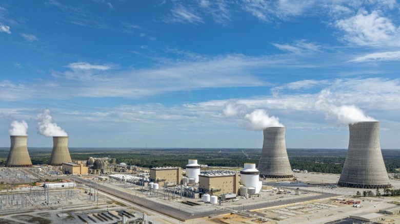 Four cooling stacks blow off steam at the Plant Vogtle nuclear facility.