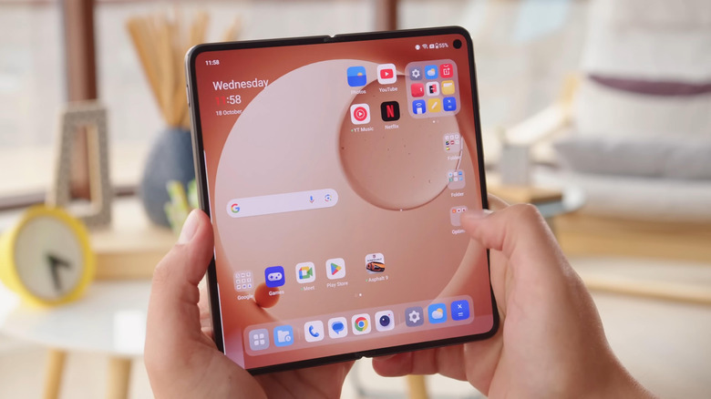 Close-up of a person using the OnePlus Open's inner display