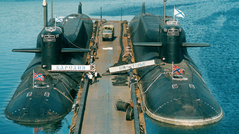 Two Russian submarines docked and out of use.