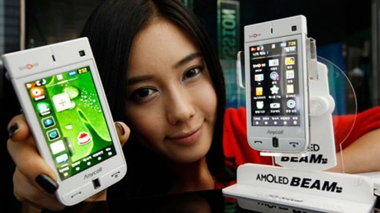 A person showcasing the Samsung AMOLED Beam phone in a promotional picture