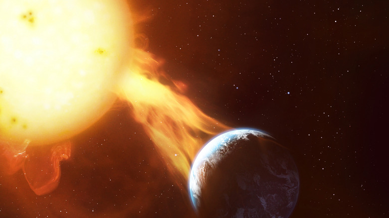 a solar storm flare from the Sun hitting Earth