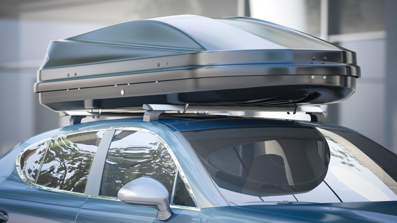 A storage box mounted on an electric vehicle's roof rack