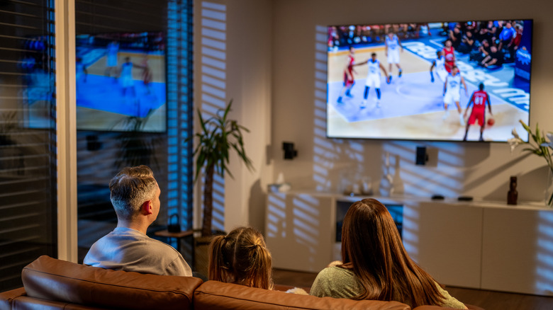 A family watching TV in their living room
