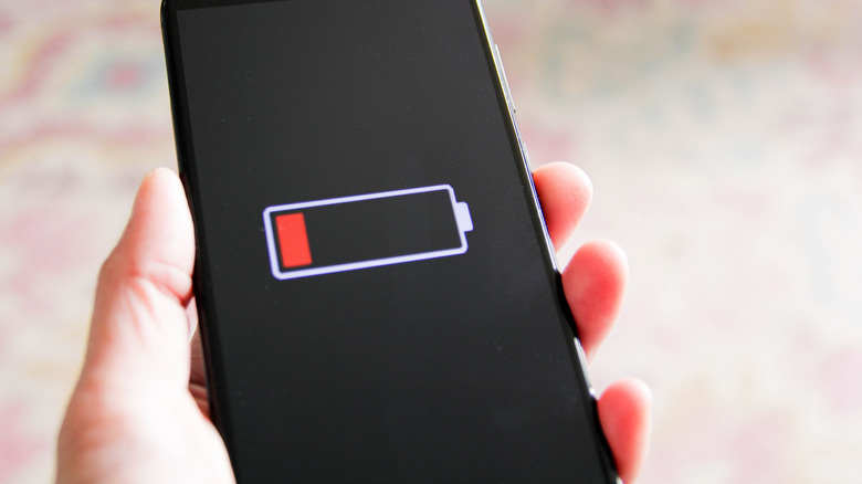 smartphone with dead battery label on screen
