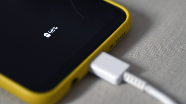Smartphone charging with USB plugged into it