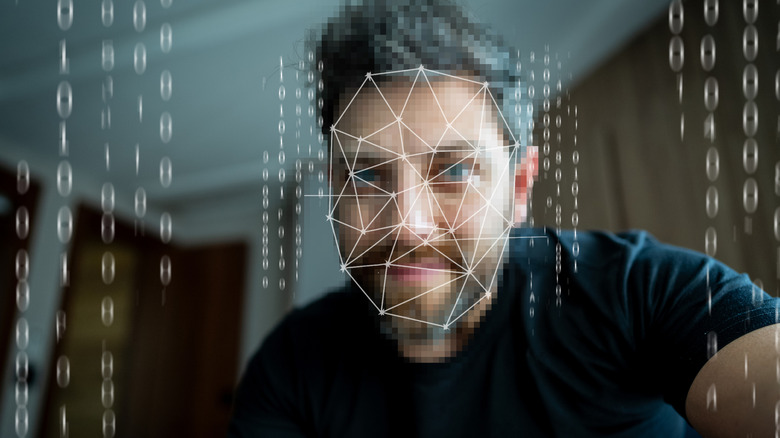 Facial scan concept, man having his face scanned, blurred for privacy