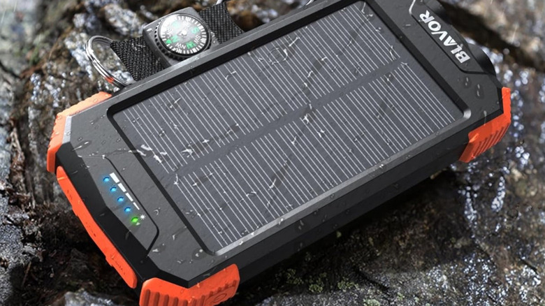 The Blavor 10,000mAh Solar Power Bank placed on a rock