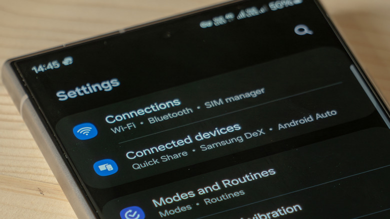 A picture showing the Settings menu in a Samsung phone with a focus on Connected devices and Samsung DeX