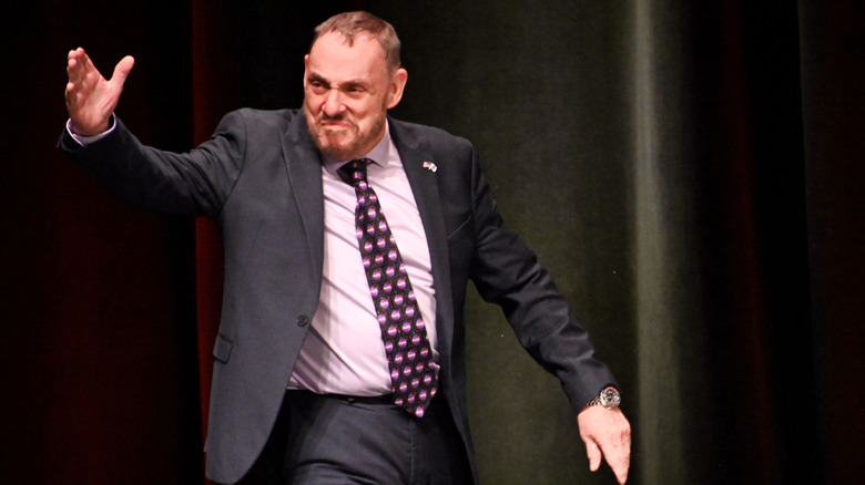 John Rhys-Davies on-stage at a convention.