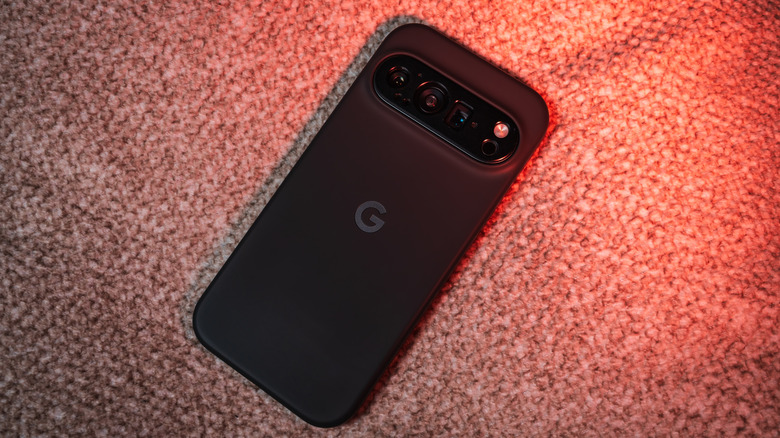 A picture of a black Google Pixel phone lying with its back facing the camera