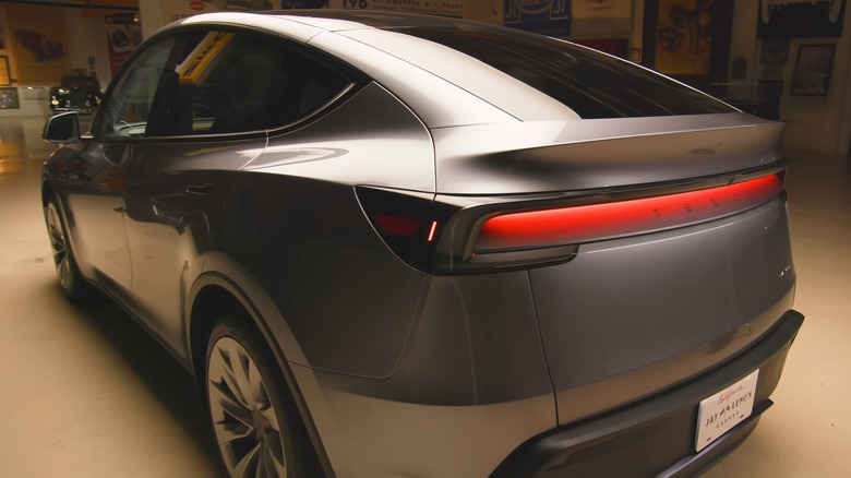 The rear light of a gray Tesla Model Y Juniper